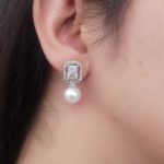 ER-2208004 - American Diamond White Stone Pearl Drop Stud Earrings