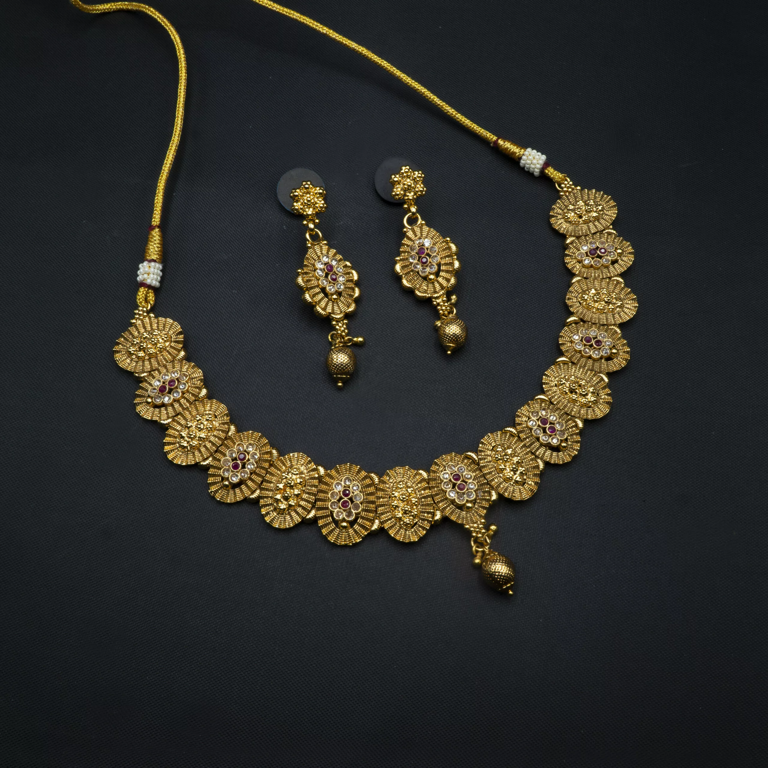 NS-2212031 - Antique Gold Finish Ruby Studded Temple Necklace Set NS-2212031 - Antique Gold Finish Ruby Studded Temple Necklace Set