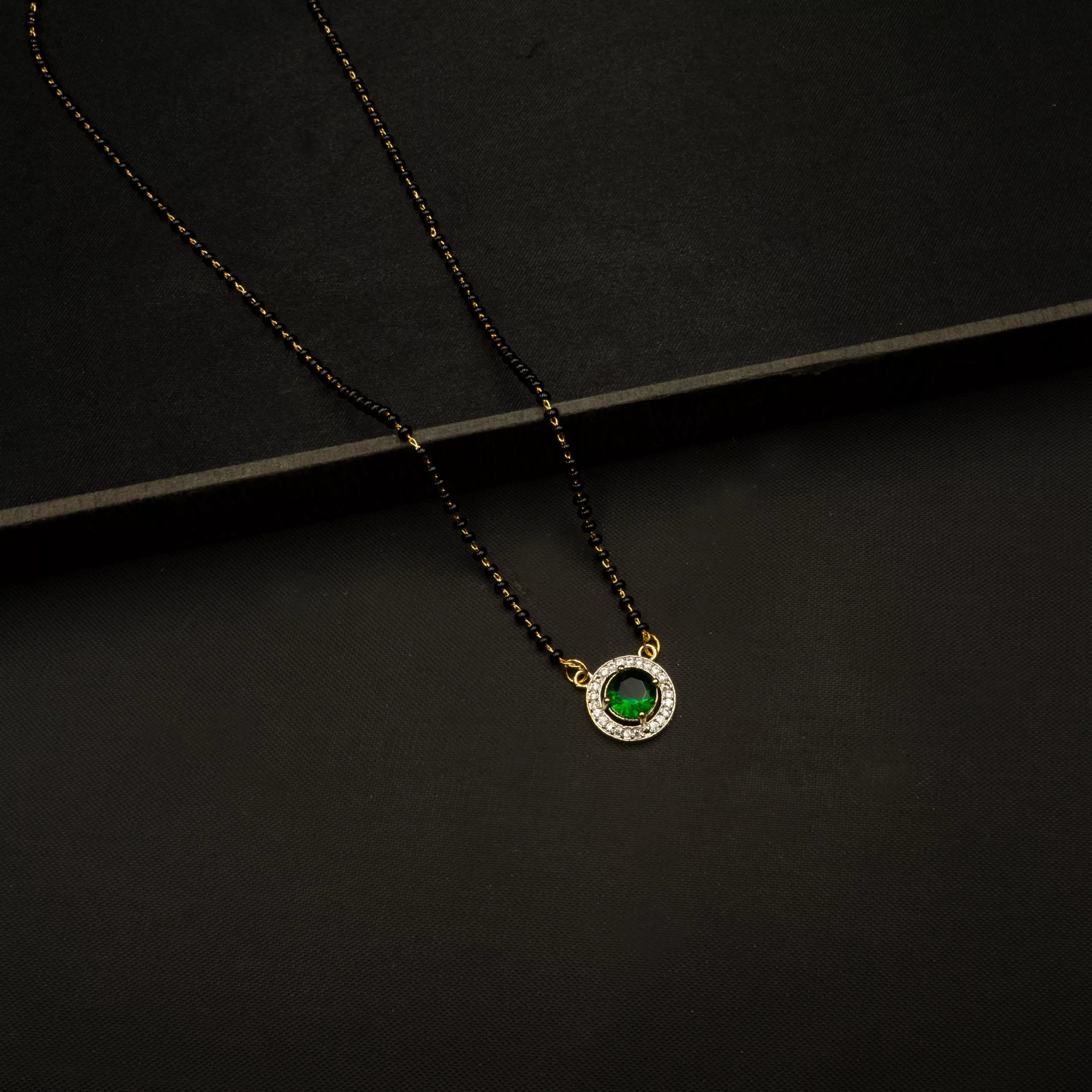 MA-2304004 - Minimal American Diamond & Green Stone Round Mangalsutra MA-2304004 - Minimal American Diamond & Green Stone Round Mangalsutra
