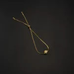 BL-2307032 - Gold Plated American Diamond Ball Adjustable Slider Bracelet