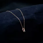 CH-2307024 - Elegant Unity Gold-Plated American Diamond Inter-Locked Locket Necklace