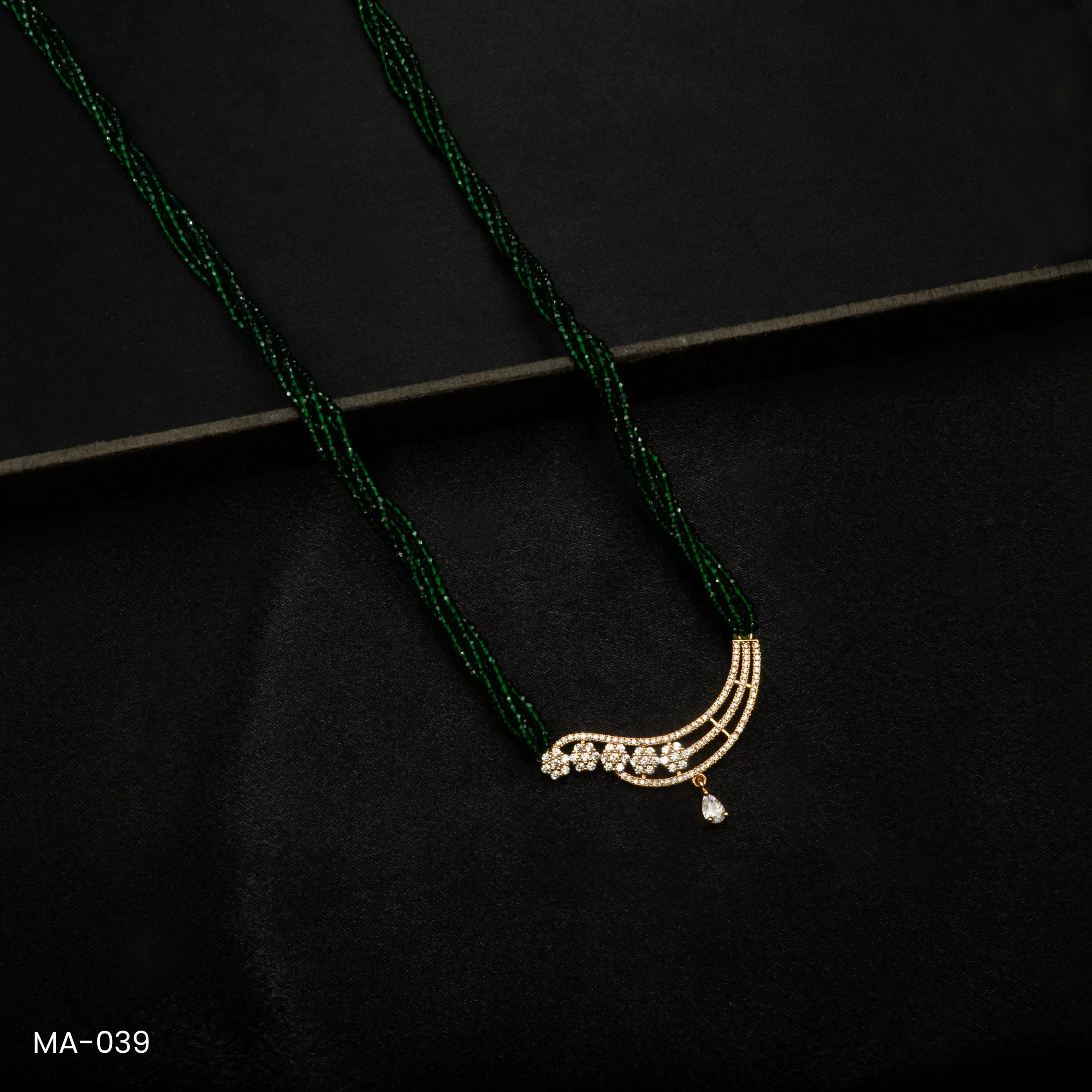 MA-039 - Gold Plated American Diamond Green Long Hydropotey Mangalsutra MA-039 - Gold Plated American Diamond Green Long Hydropotey Mangalsutra