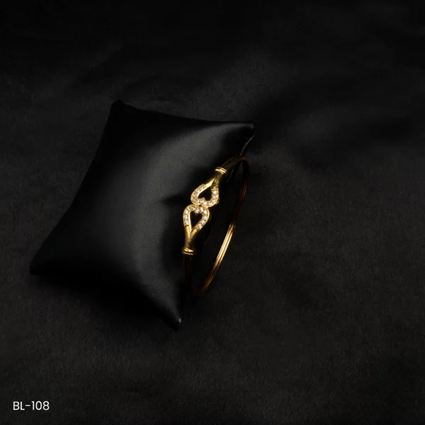 BL-108 - Luxe Twist Gold Plated Bracelet with Elegant American Diamond Embellishments