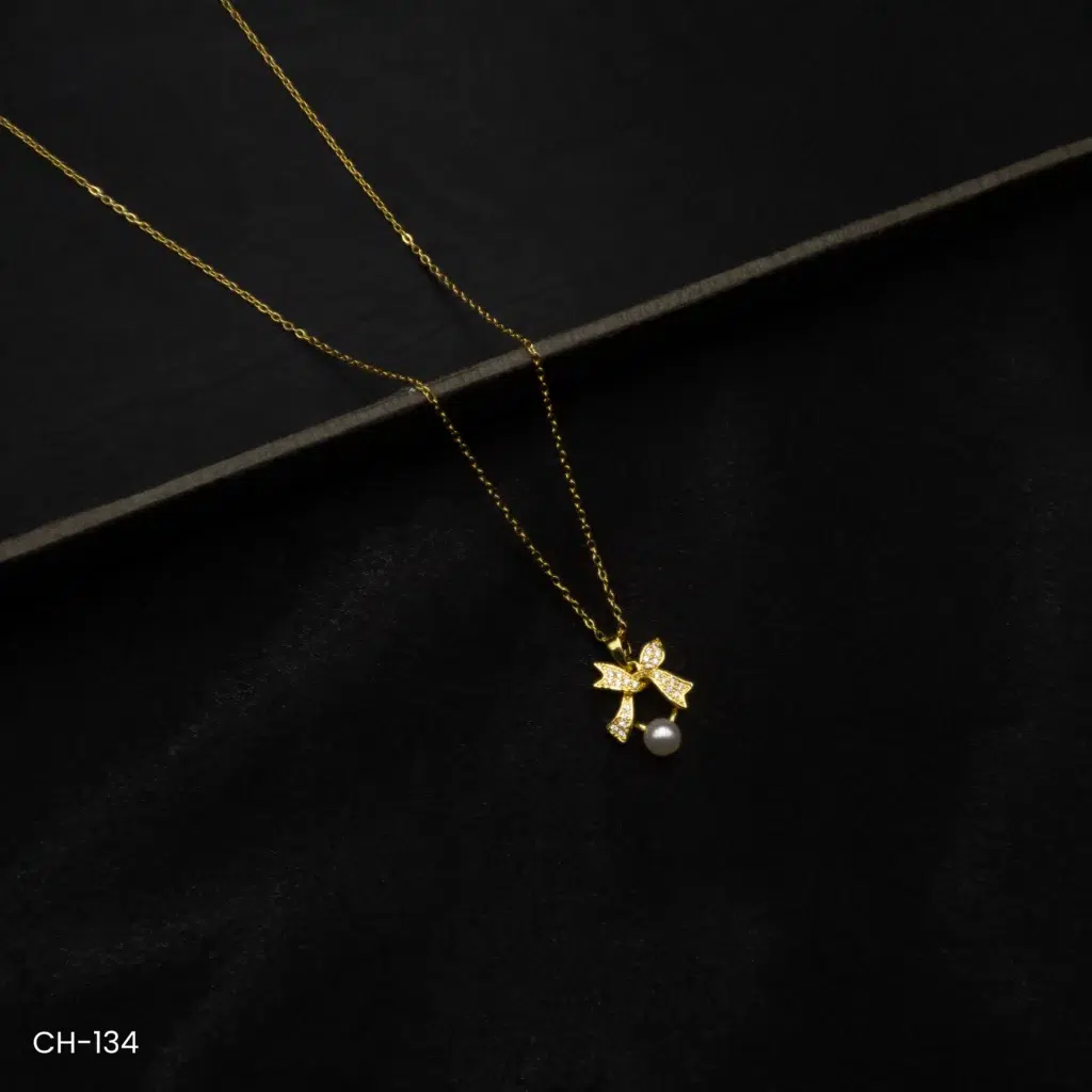 CH-134 – Timeless Charm American Diamond Graceful Bow & Pearl Pendant Necklace