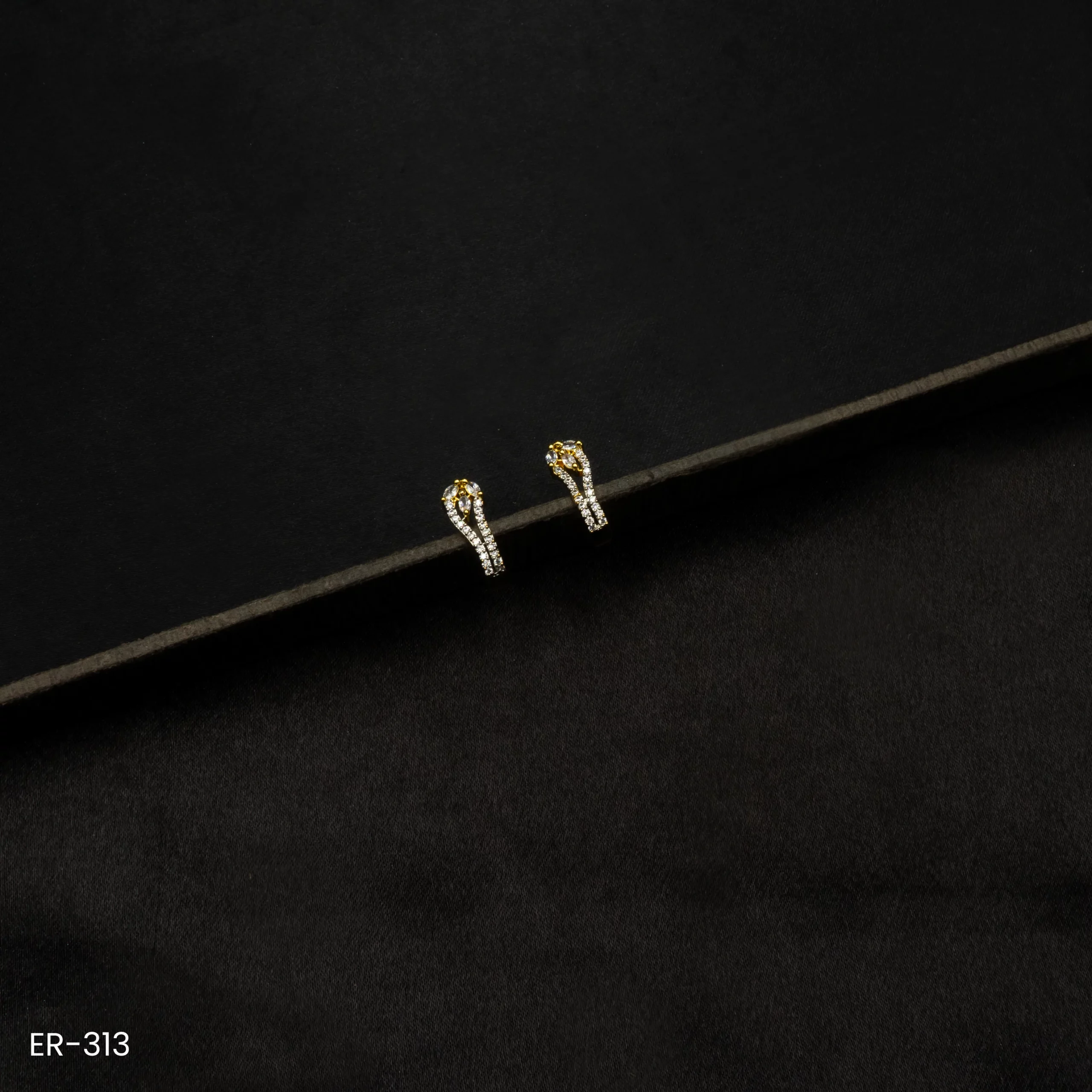 ER-313 - Trendy Design Modern Gold Plated American Diamond Curvy Studs ER-313 - Trendy Design Modern Gold Plated American Diamond Curvy Studs