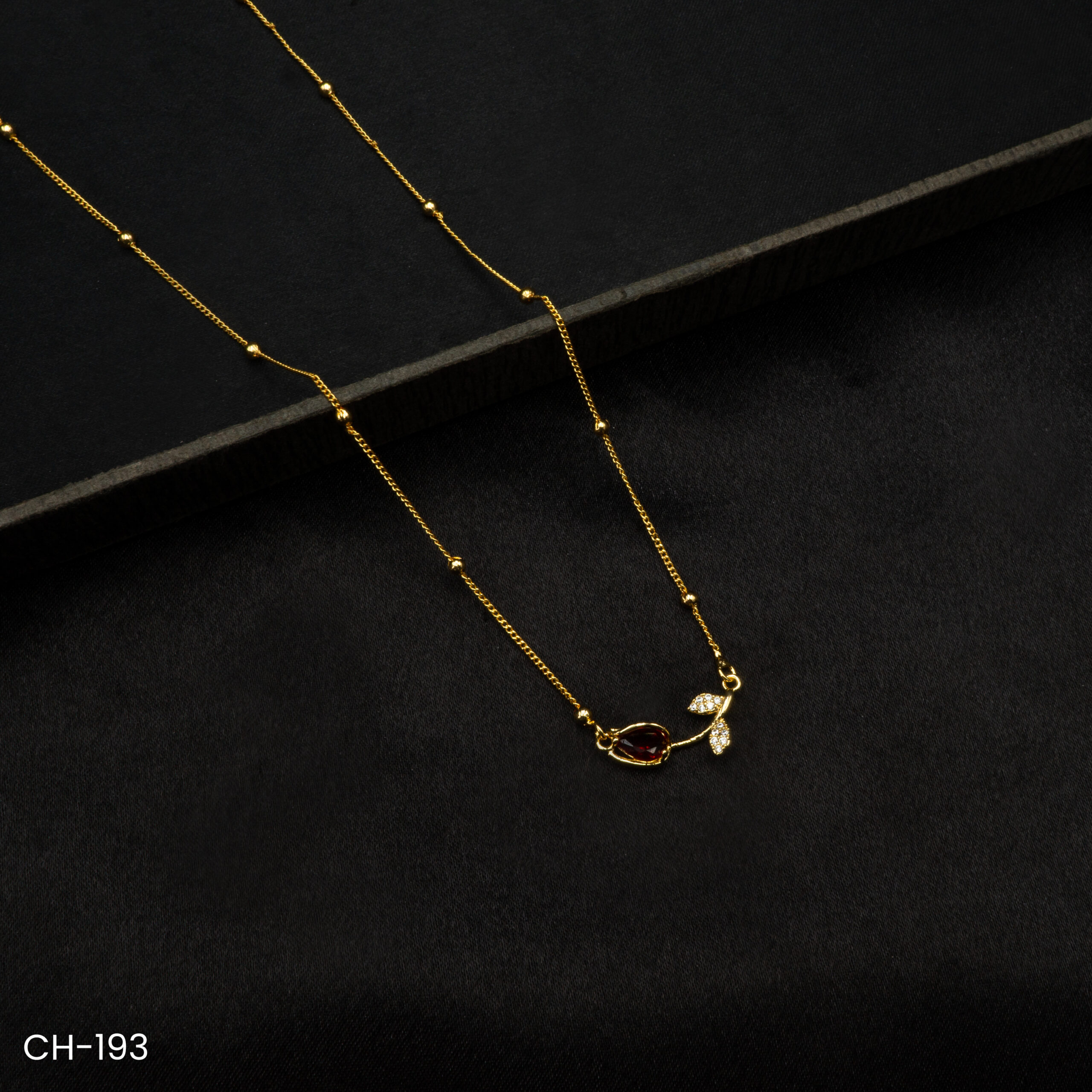 CH-193 - Graceful Sparkle Delicate Gold Plated Leaf and Ruby Drop Necklace CH-193 - Graceful Sparkle Delicate Gold Plated Leaf and Ruby Drop Necklace