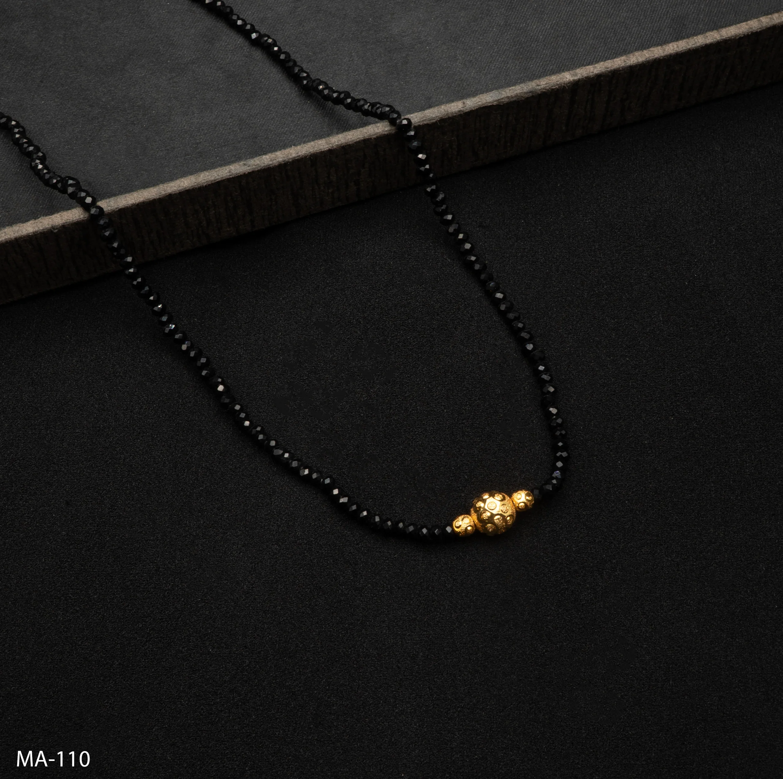 MA-110 - Vibrant Black Beaded Mangalsutra with Classic Gold Ball Pendant MA-110 - Vibrant Black Beaded Mangalsutra with Classic Gold Ball Pendant